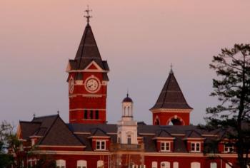 historic building at dusk with clock tower