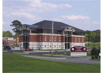 brick building with a signboard out front