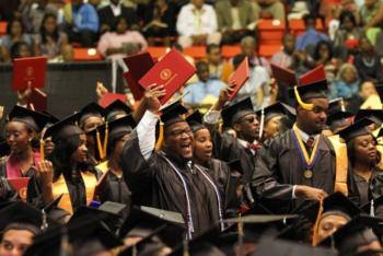 graduates in caps and gowns at commencement ceremony