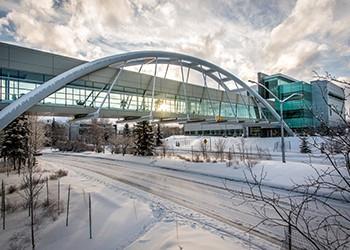 snow-covered bridge at campus during winter