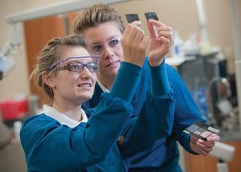 students conducting an experiment in lab