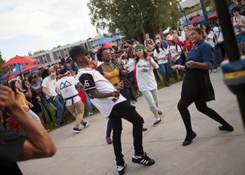 students dancing at an outdoor event