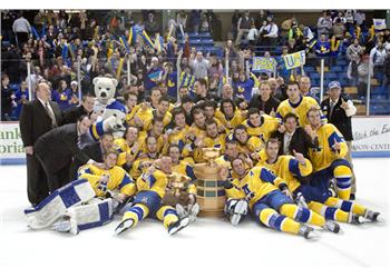 hockey team posing with trophy