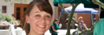 smiling woman with campus background