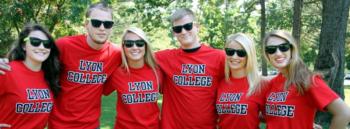 group in 'lyon college' red t-shirts and sunglasses