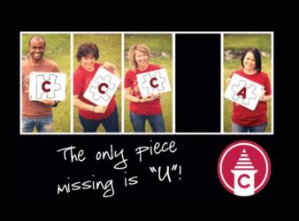 four people holding letters 'c', 'c', 'c', '_', 'a' with text 'the only piece missing is 'u'!'