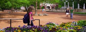 students and colorful flowers in campus outdoor area