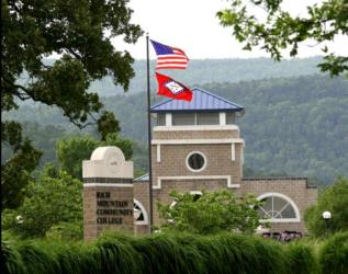 campus building with flags and sign 'rich mountain community college'