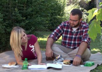 two people studying at a picnic