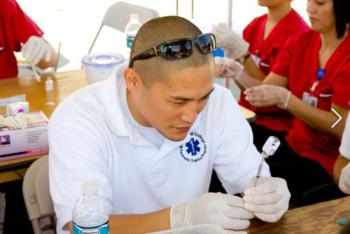 man in medical outreach event