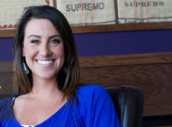 woman in blue top smiling