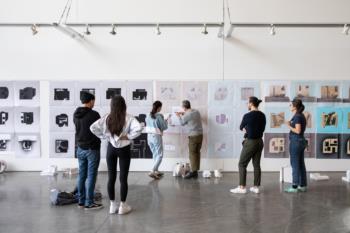 people viewing artwork in a gallery setting