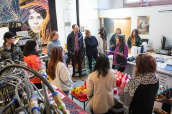 group workshop in a textile studio with various materials