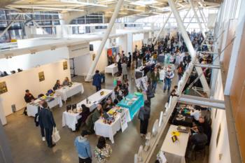 aerial view of bustling fair in an indoor atrium