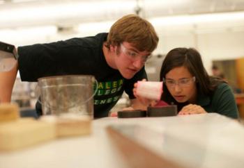 two students engaged in an experiment