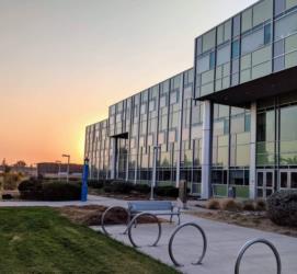 modern building with glass facade at sunrise