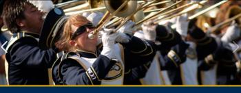 marching band members playing brass instruments