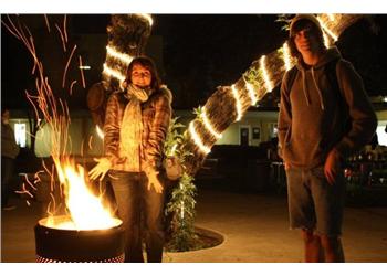 two people with a firework display at night