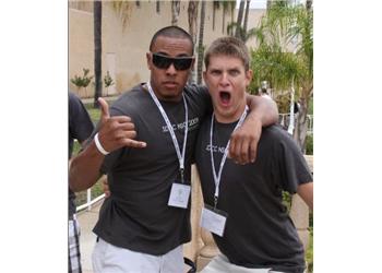 two students in sunglasses gesturing