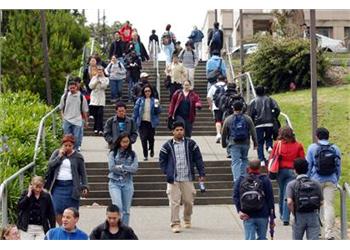 students walking down outdoor steps on campus