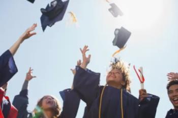 graduates tossing caps in the air