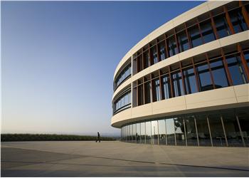 modern campus building with person outside