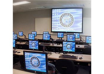 computer lab with screens showing institution's logo