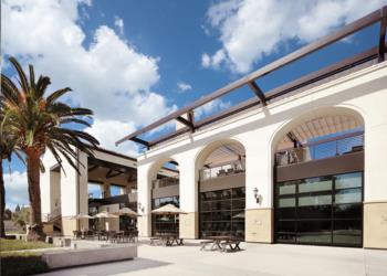 modern campus building with outdoor seating