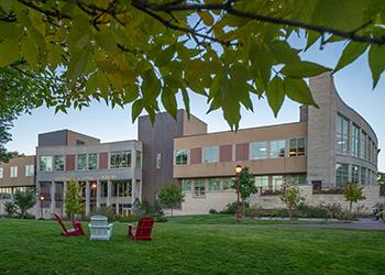 modern campus building with outdoor seating