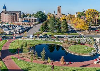 campus view with pond and fall colors