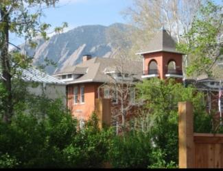 campus building with mountain backdrop