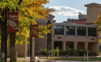 campus building with autumn foliage