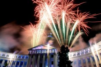 fireworks display over a building at night