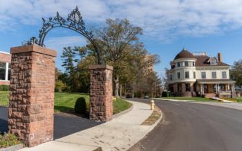 campus entrance with archway and building