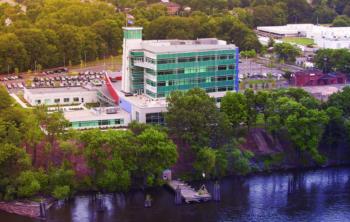 aerial view of a modern building by the water