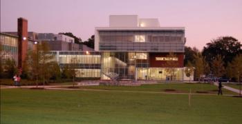 twilight view of a modern campus building