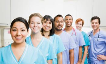 group of smiling healthcare professionals in scrubs