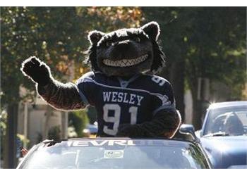 mascot waving from a car in jersey number 91