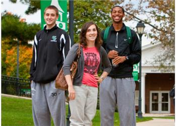 three students walking together on campus