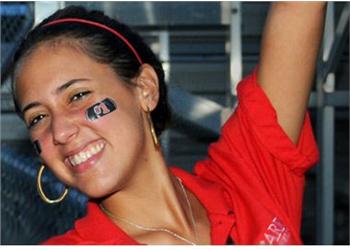 woman with face paint cheering