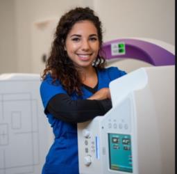 woman in lab coat by equipment