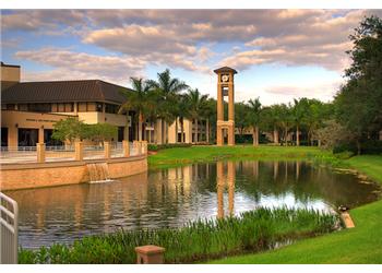 campus with clock tower and water feature