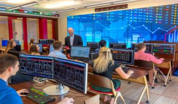 students in a trading simulation lab