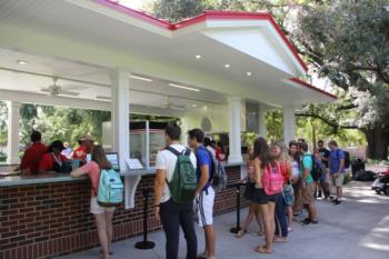 students lined up at food stand