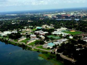 aerial view of a campus and lake