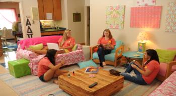 students lounging in a dorm room