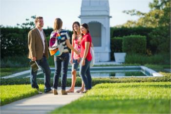 group chatting by a water feature