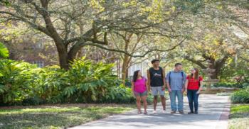 students walking on campus pathway