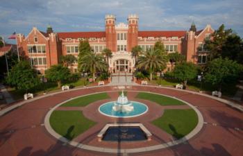 landscape view of 'fsu' with fountain and red-brick buildings