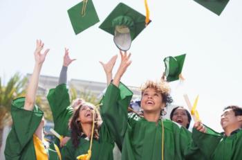 graduates tossing caps in the air